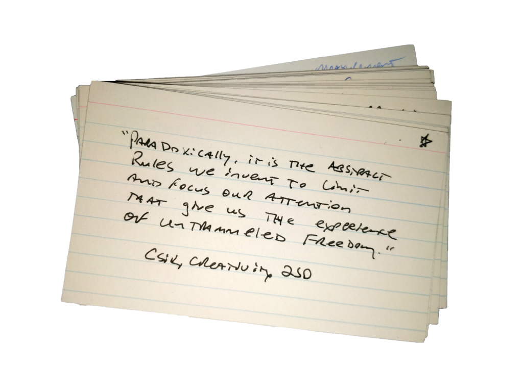 A 3x5 index card with a quote from a book.